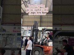 Cargando la celda de molienda robótica de los clientes en el contenedor